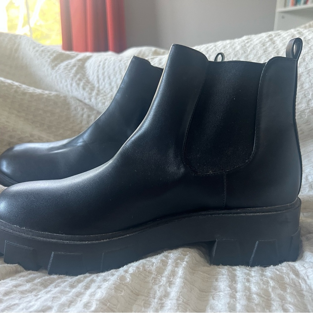 BRAND NEW. NEVER WORN. Sleek Black Ankle Boots